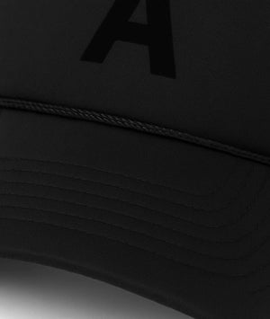 Black cap with a letter 'A' on a dark background