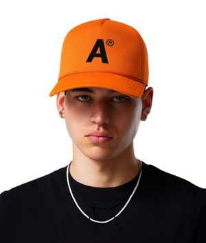 Person wearing an orange cap with a logo on a white background