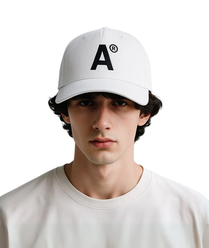 Person wearing a white cap with a black letter 'A' logo on a transparent background