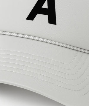 White cap with a black letter 'A' on a light gray background