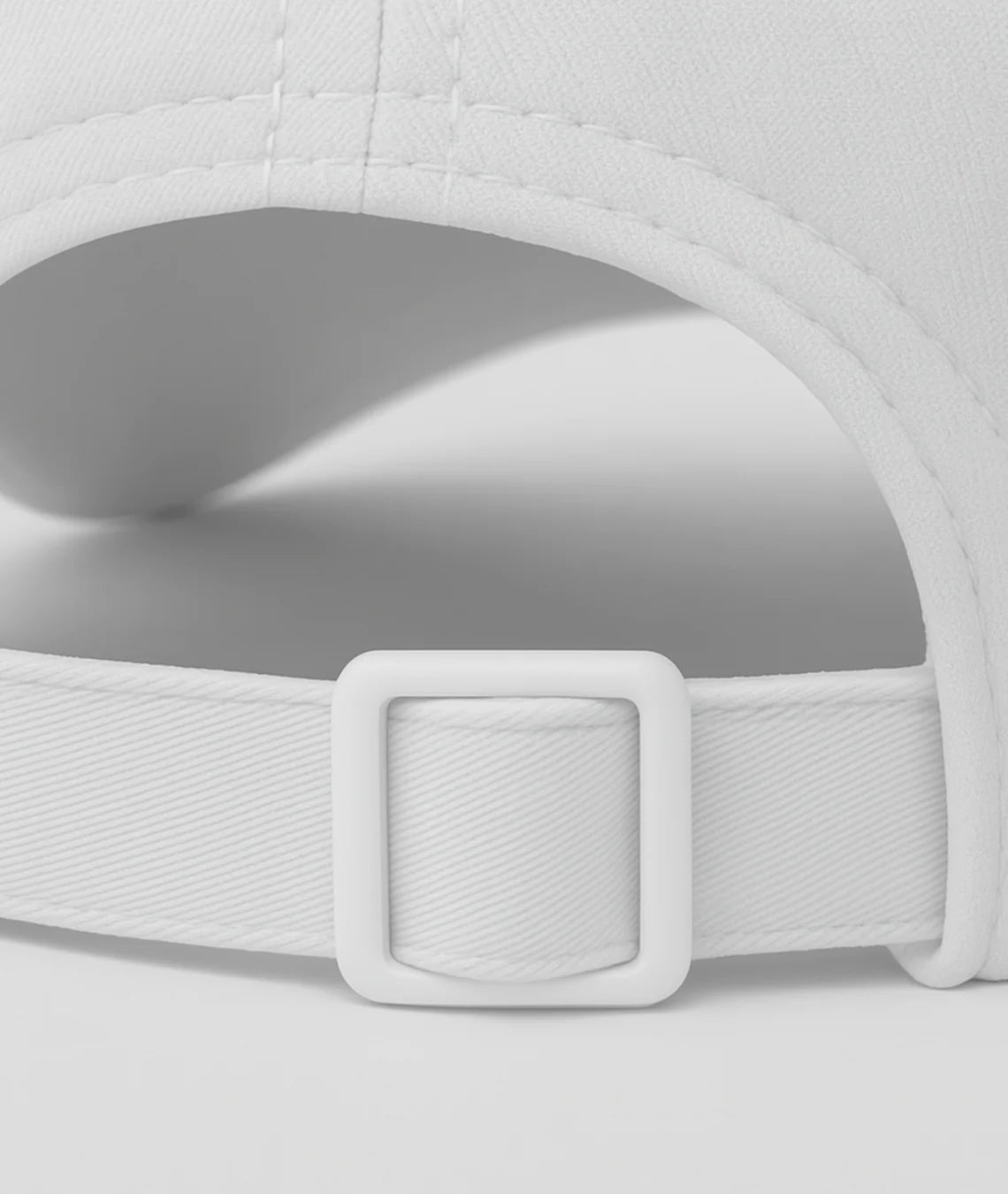 Close-up of a white cap with a buckle on a light gray background