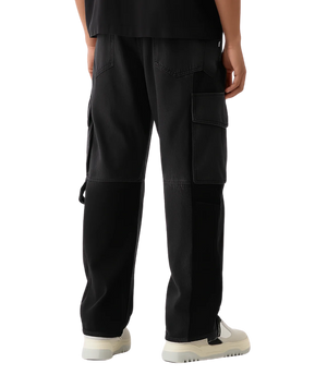 Black cargo pants worn by a person on a transparent background