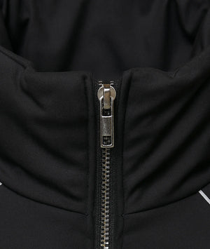 Close-up of a black jacket zipper with metallic finish