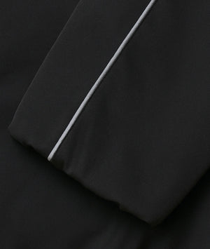 Black fabric with a white stripe on a black background