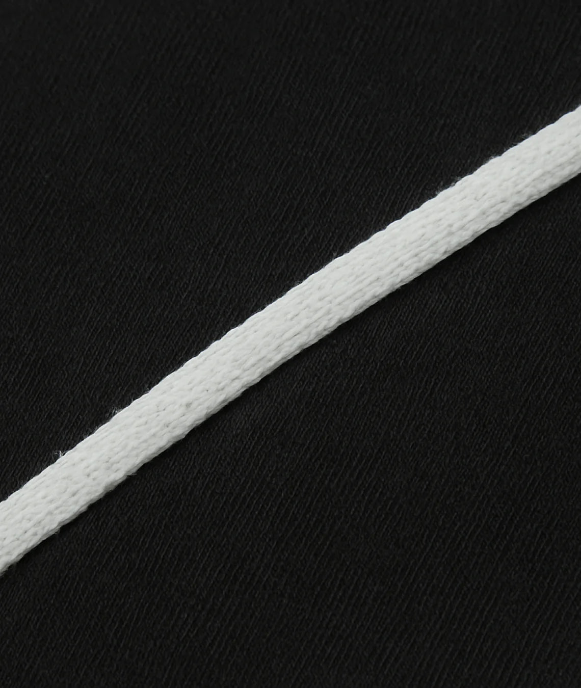 White cord on a black textured background