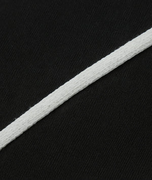 White cord on a black textured background