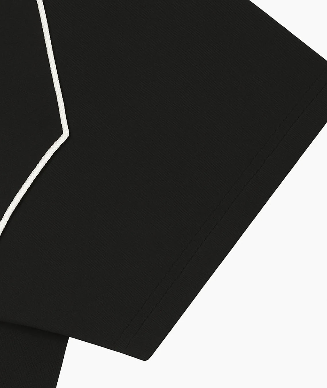 Black fabric with white stitching on a white background