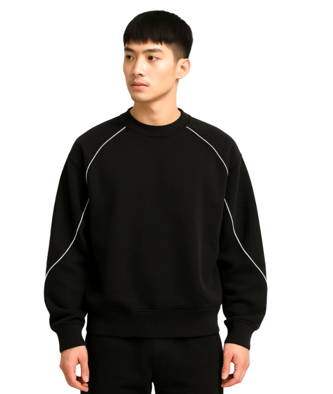 Person wearing a black sweatshirt with white accents on a white background