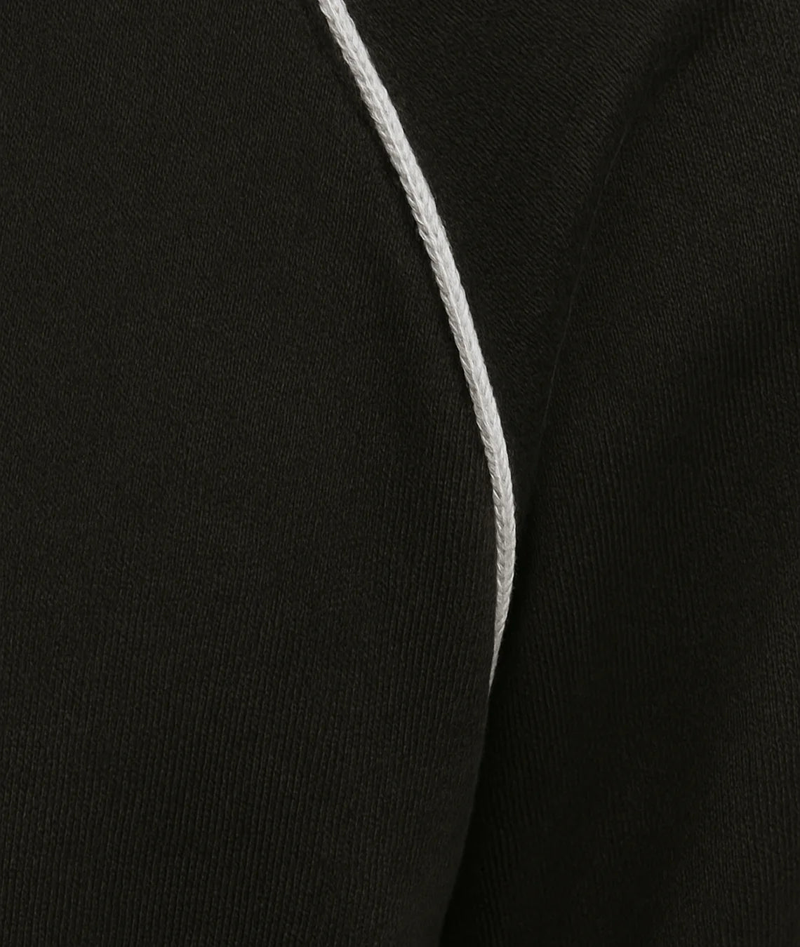 Close-up of a black garment with a white line running through it