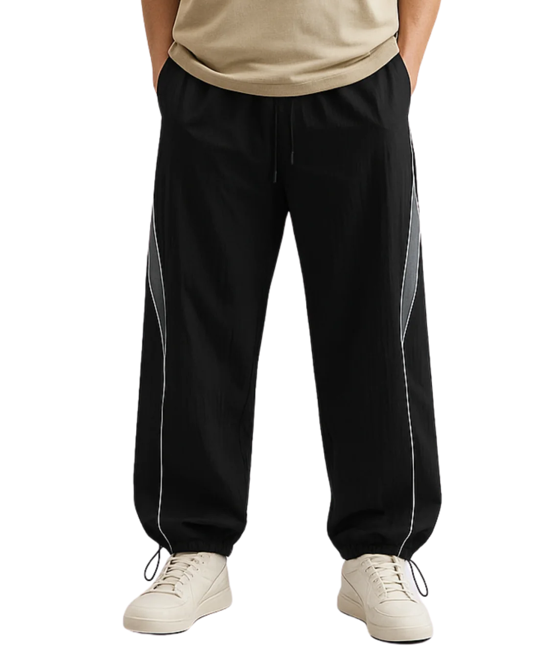 Black track pants with white stripes worn by a person on a white background