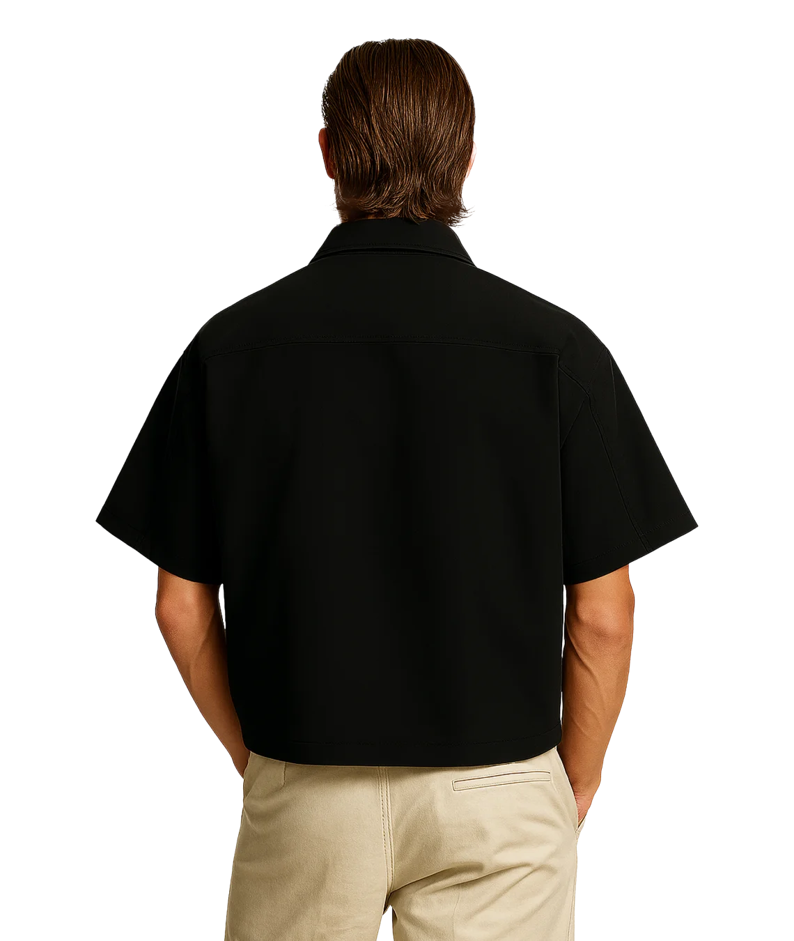 Person wearing a black shirt and beige pants on a white background