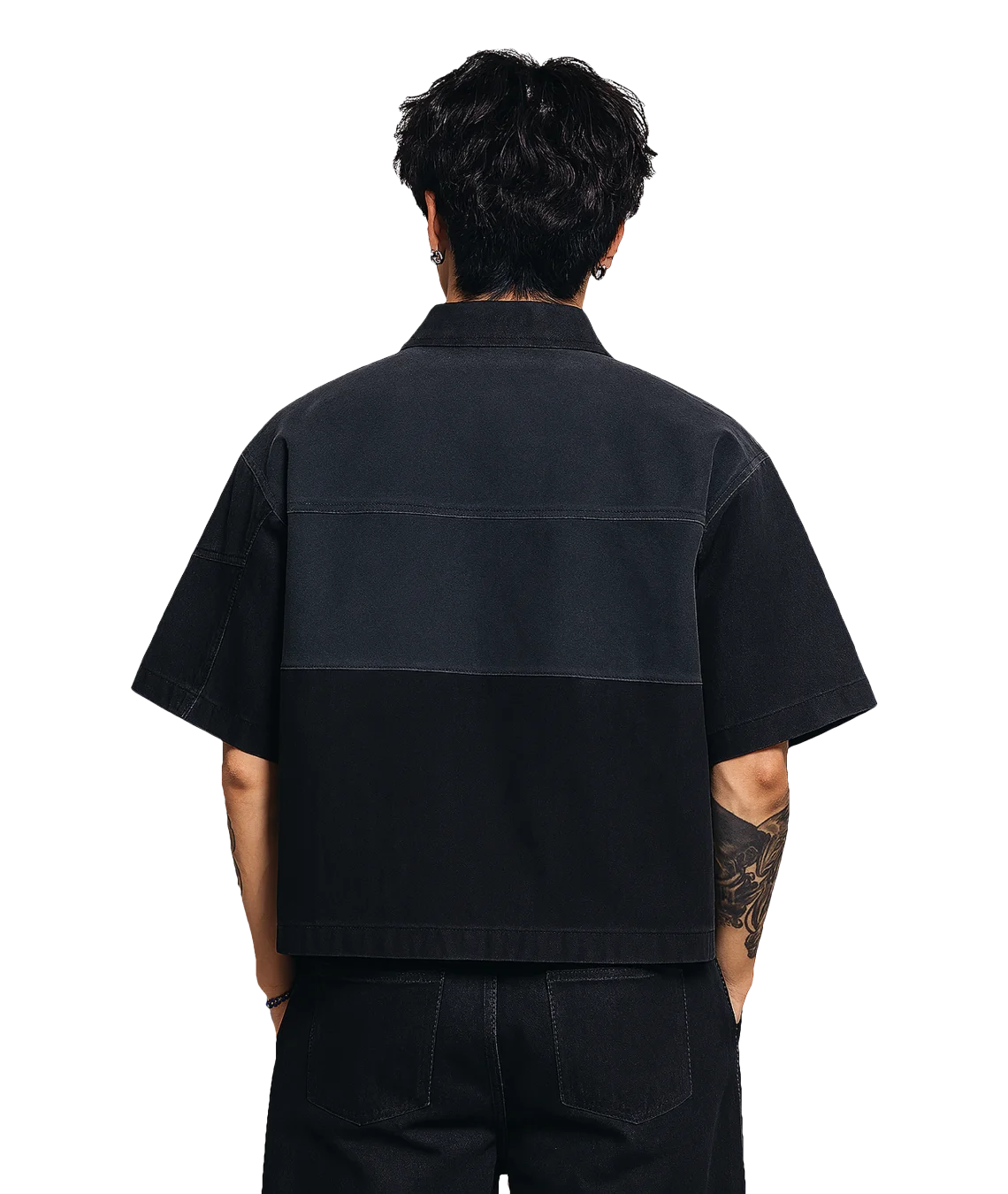 Person wearing a black short-sleeve shirt on a white background