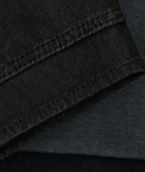 Close-up of black fabric with stitching detail