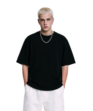 Person wearing a black t-shirt and white pants on a white background
