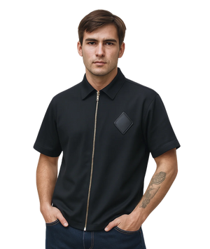 Man wearing a black short-sleeve shirt with a zipper on a white background