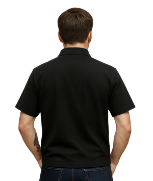 Man wearing a black polo shirt on a white background