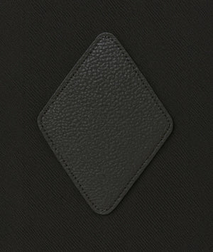 Black textured square patch on a black background