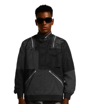 Person wearing a black jacket with white accents on a transparent background
