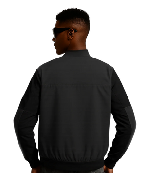 Person wearing a black jacket on a white background