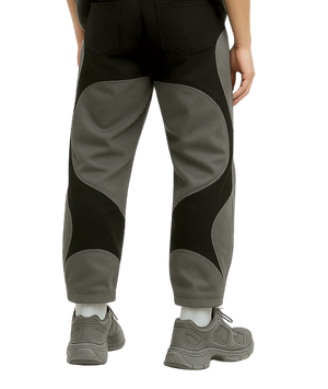 Dark gray pants worn by a person on a transparent background