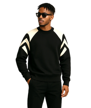 Man wearing a black and white striped sweater on a white background