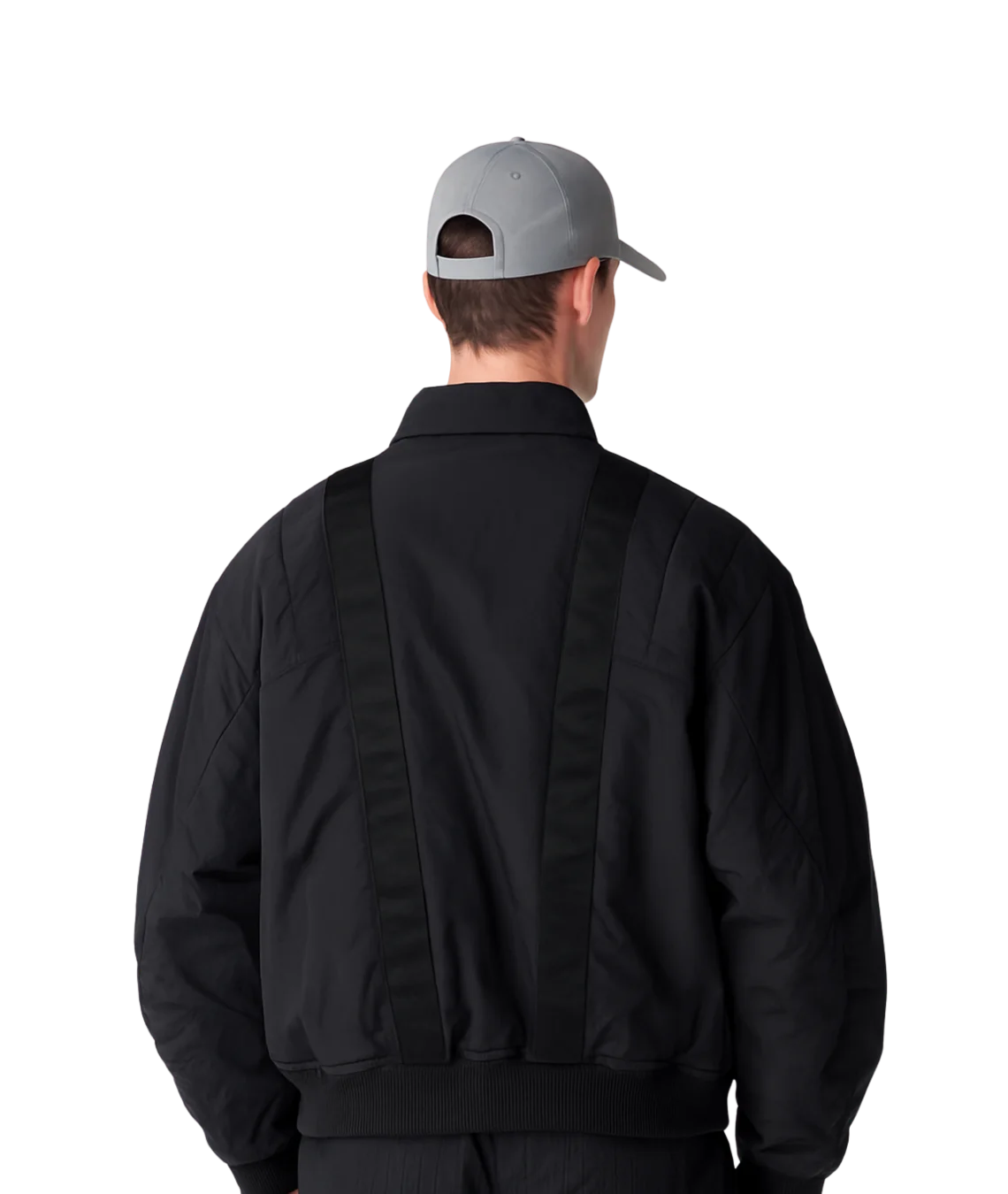 Person wearing a black jacket and gray cap from behind on a white background