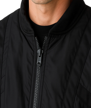 Close-up of a black jacket with a zipper on a white background