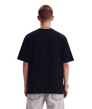 Person wearing a black t-shirt on a white background