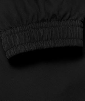 Close-up of a black textured fabric with a focus on texture and color.