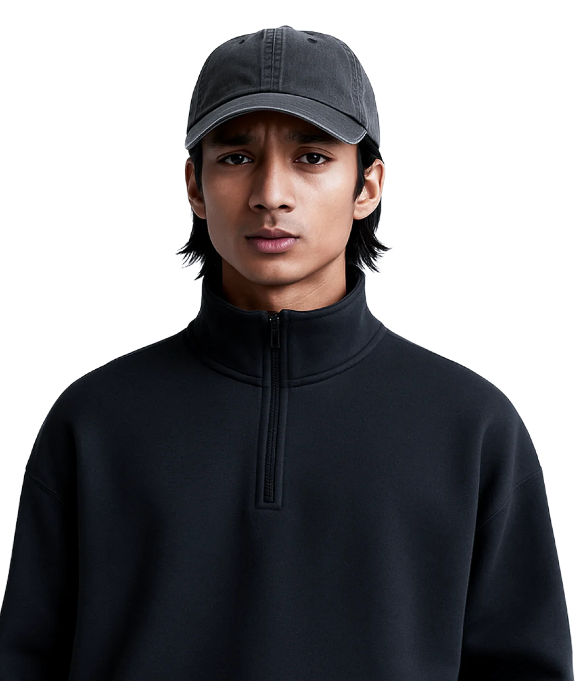 Person wearing a black turtleneck sweater and gray cap on a white background