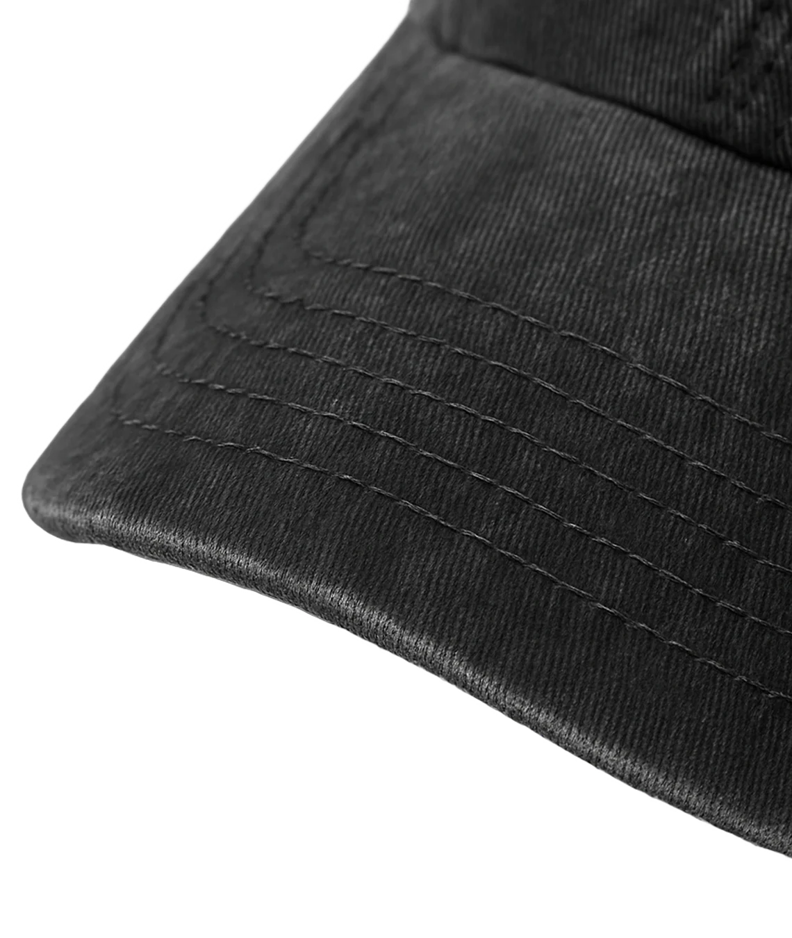 Close-up of a black cap with textured surface on a transparent background