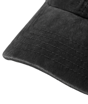 Close-up of a black cap with textured surface on a transparent background