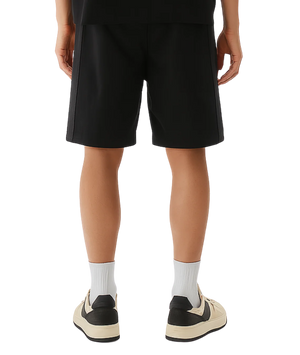 Person wearing black shorts and white socks with a transparent background