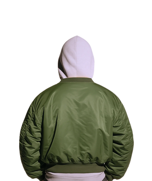 Green jacket worn by a person on a white background