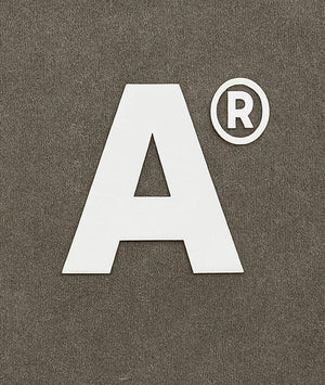 White letter 'A' with a registered trademark symbol on a brown background