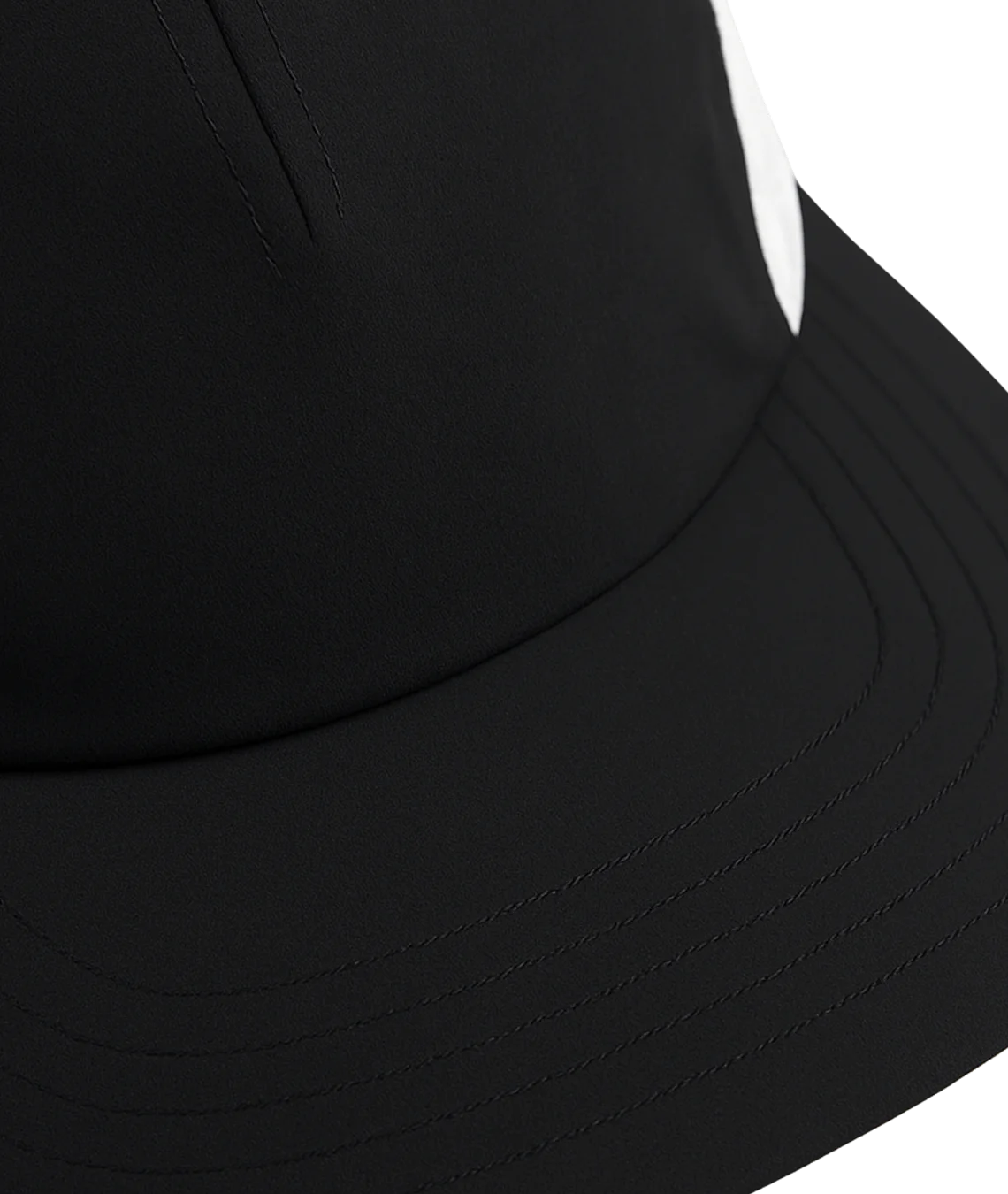 Close-up of a black cap with a white background