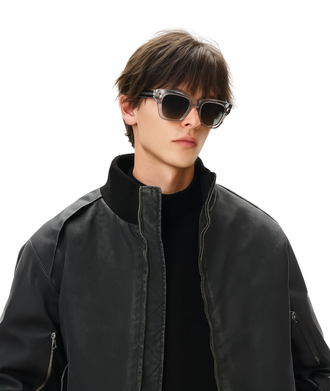 A man wearing stylish cat-eye sunglasses with a glossy black frame, a black turtleneck, and a black leather bomber jacket, set against a solid white background.