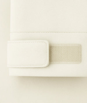 Close-up of a textured white surface with a rectangular cutout