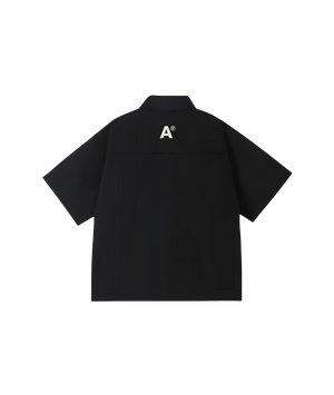 Black polo shirt with a logo on the back against a white background