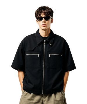 Man wearing a black jacket with zippers on a white background