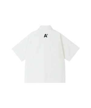 White polo shirt with a black logo on the back against a white background