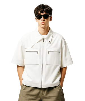 Man wearing a white short-sleeve jacket with a zipper, sunglasses, and beige pants on a white background