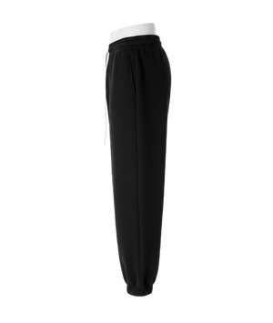 Black pants with a white waistband on a white background