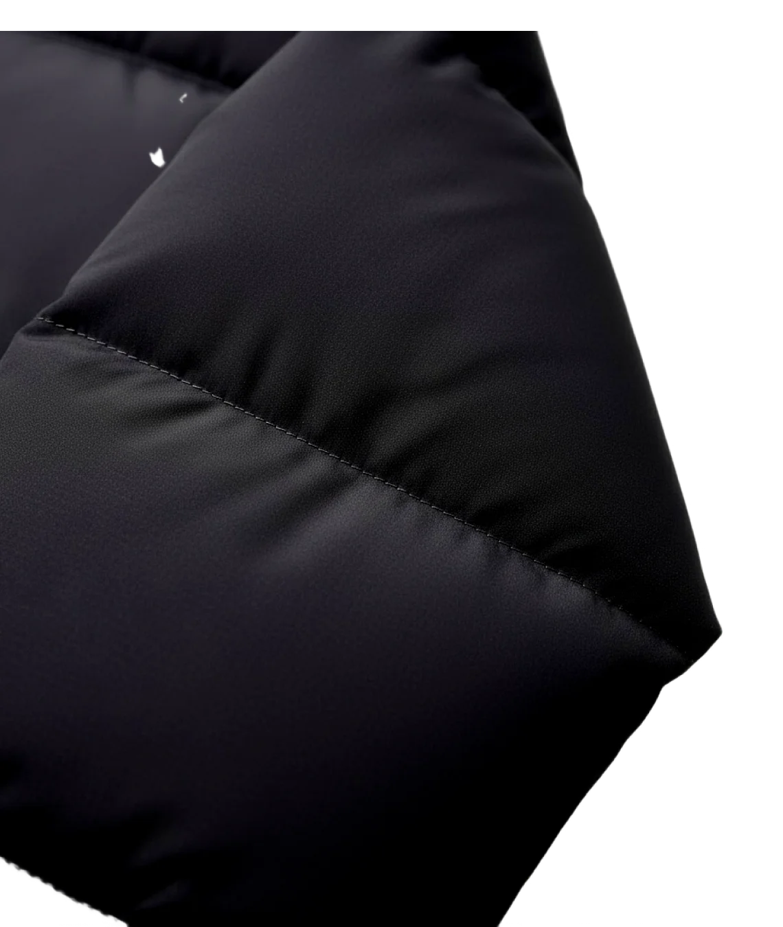 Close-up of a black puffer jacket with quilted design