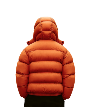 Orange puffer jacket on a white background