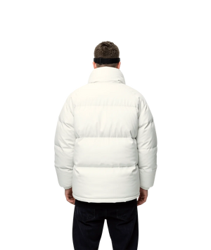 Person wearing a white puffer jacket on a white background