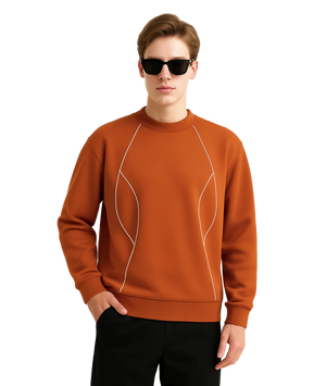 Man wearing a brown sweatshirt with white accents on a white background