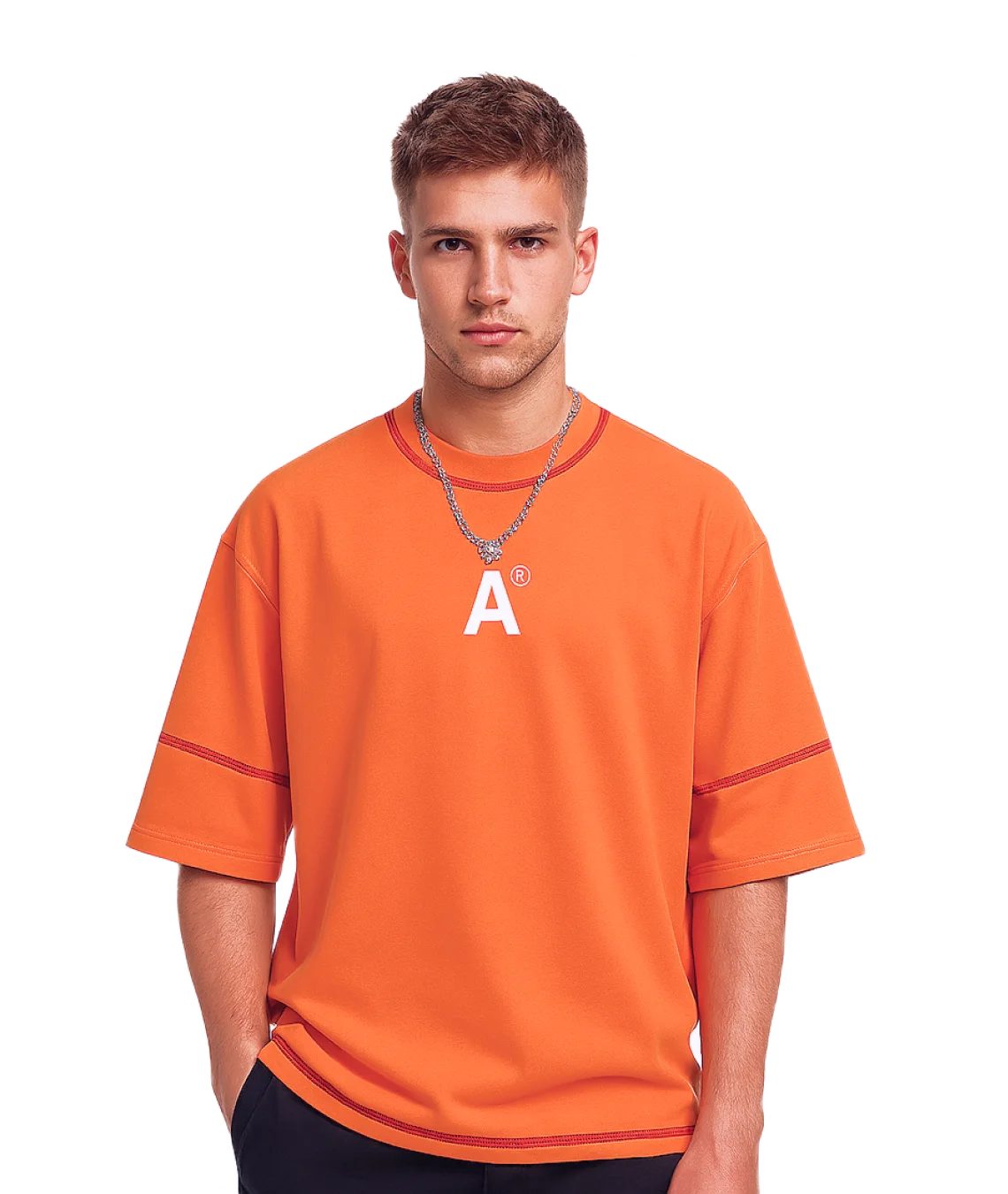 Person wearing an orange t-shirt with a logo on a white background