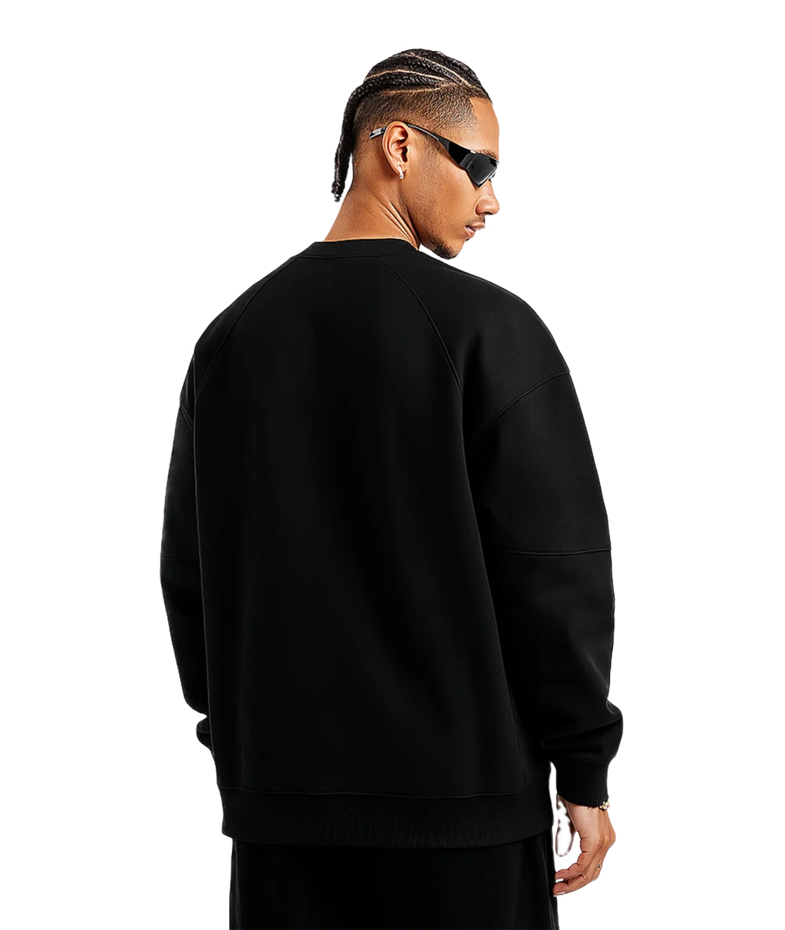 Person wearing a black sweatshirt on a white background