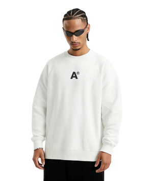 Person wearing a white sweatshirt with a logo on a white background